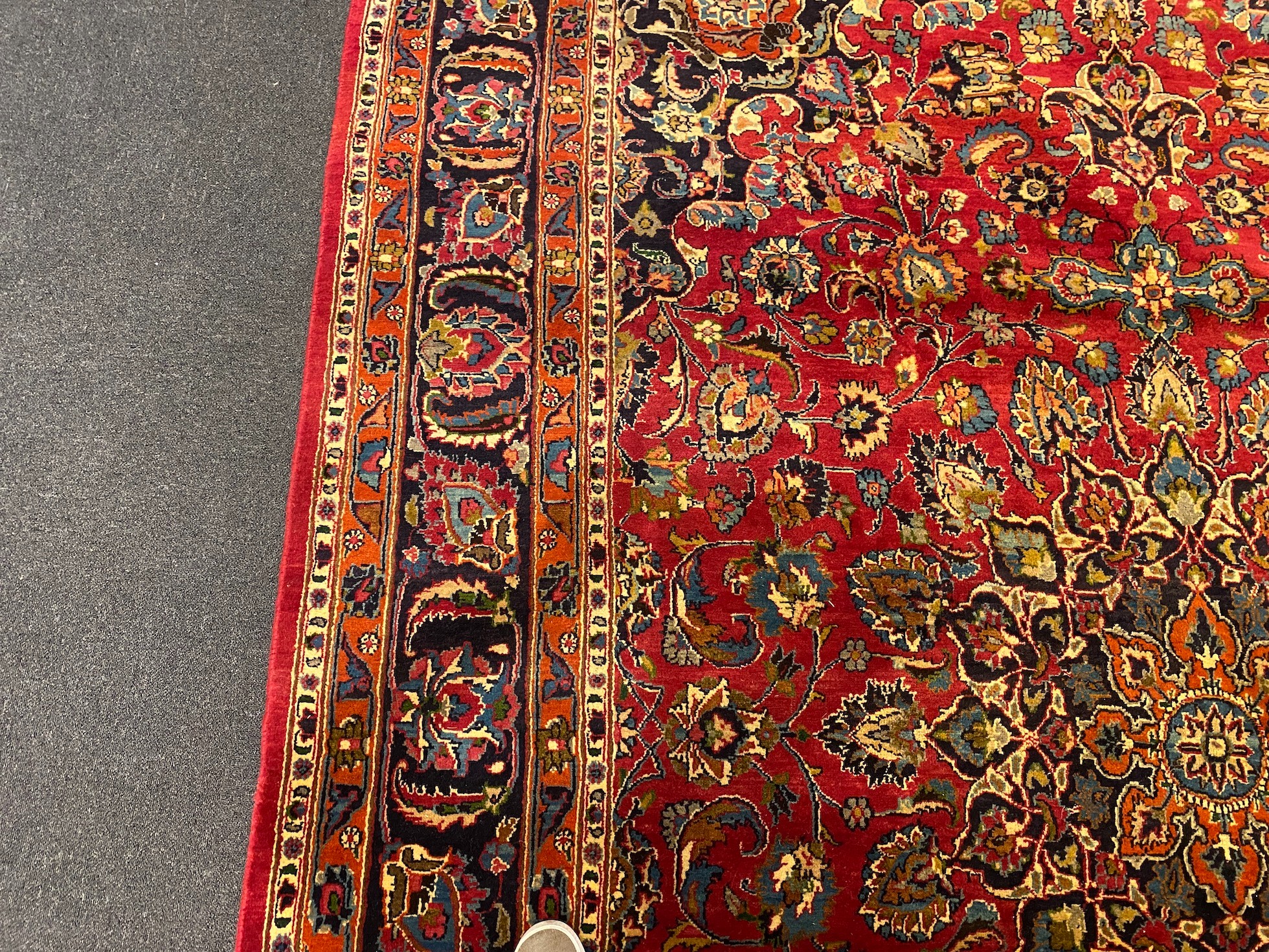 A Kashan claret ground carpet, 375cm x 250cm